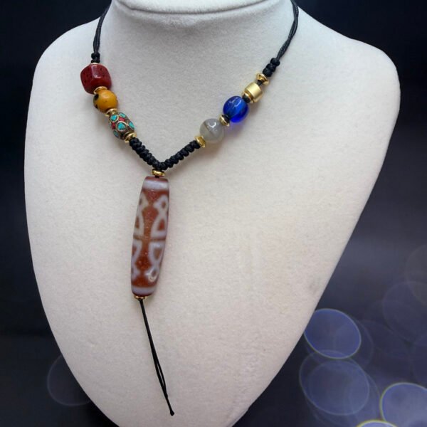 Alternative view of Five God Wealth Dzi Bead