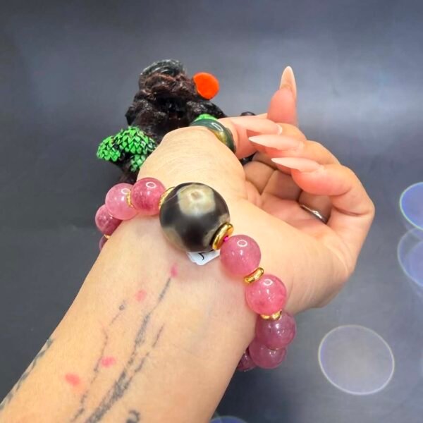 Alternative view of Three-Eye Vajrayana Dzi × Strawberry Quartz